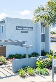 a garden with trees and shrubs at Fiesta Apts, Lompoc, 93436