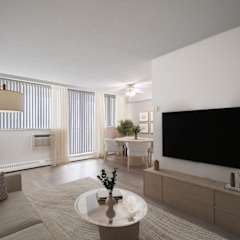 A modern living room with a large couch, a coffee table, and a flat-screen TV.