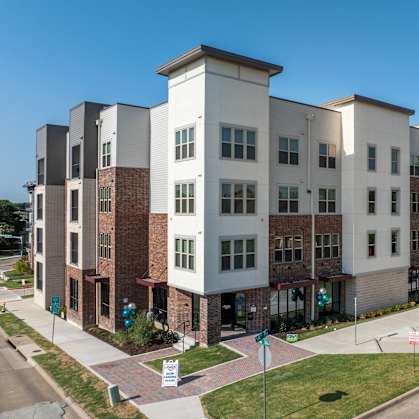 A row of modern apartment buildings are shown in the image.