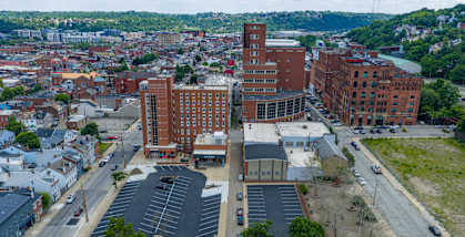 A large building with a parking lot in front of it.