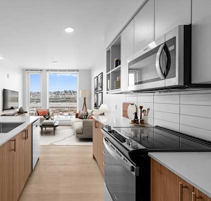 A modern kitchen with a view of the city.