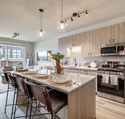 an open kitchen and dining area with a table and chairs