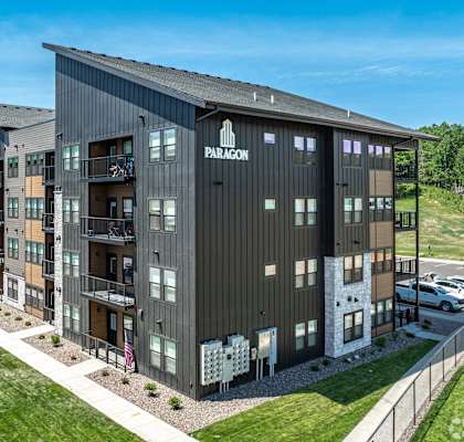 A modern apartment complex named Paragon is shown in the image.