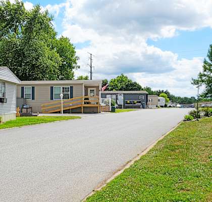 A residential street with houses on both sides.