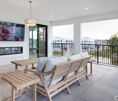 A modern outdoor seating area with a view of the city.at Imperial Crossing Luxury Apartment Homes, Bonita Springs, FL, 34134