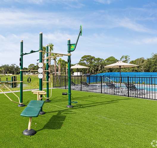 a park with a playground and a swimming pool