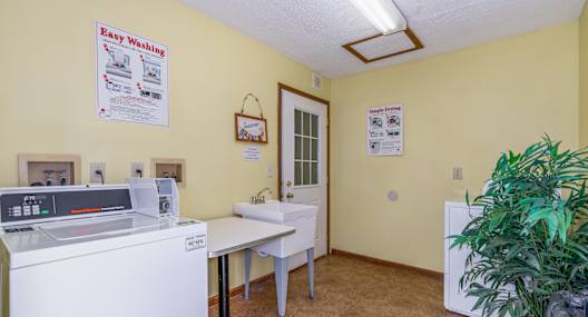 A laundry room with a washing machine and a dryer.
