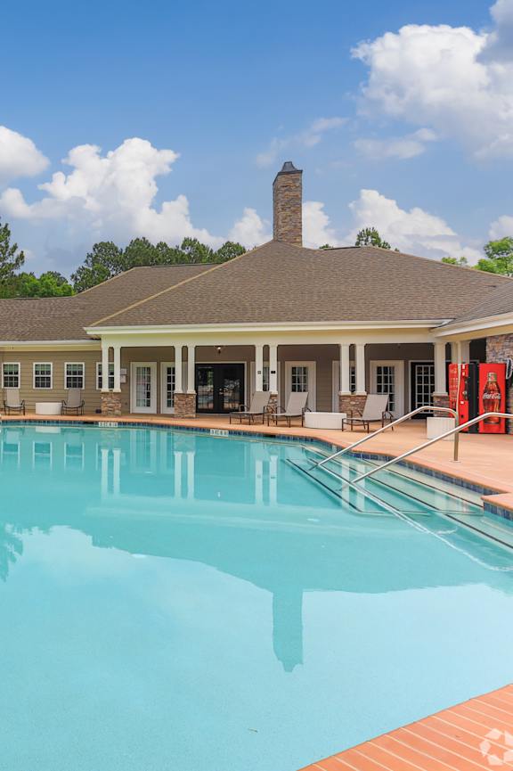 A large swimming pool in front of a building at Waterleaf at Neely Ferry Apartments, Simpsonville, SC 29680