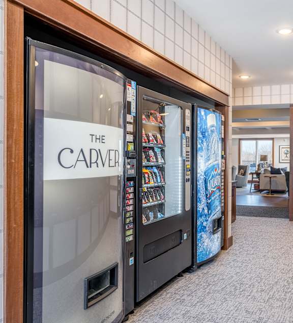 a locker room with wooden lockers and a checkered rug
