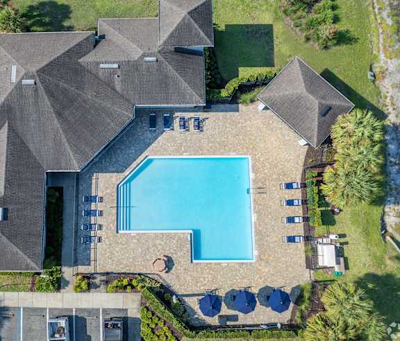 A large house with a pool in the backyard.
