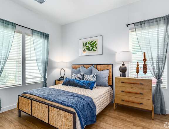 a bedroom with a bed and a dresser