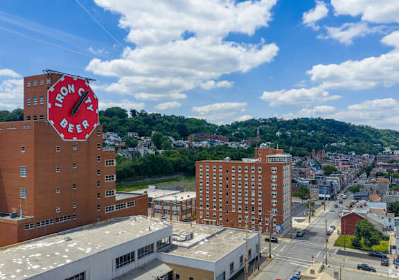 A view of a city with a large building that has a sign on it.at The Jones Tower at the Collective, Pennsylvania