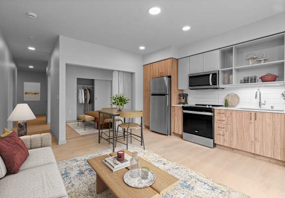 A modern kitchen with wooden cabinets and stainless steel appliances.
