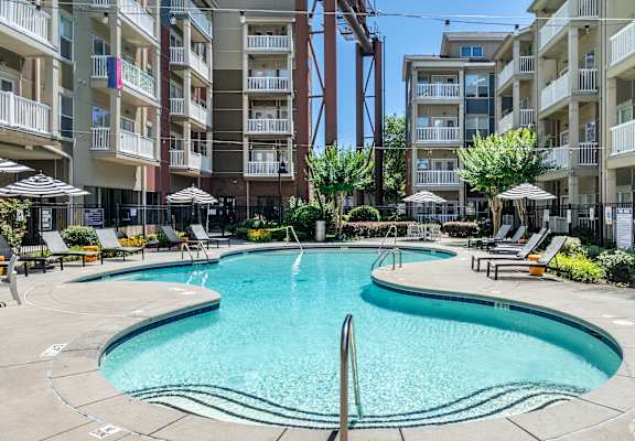 a swimming pool in the middle of an apartment building