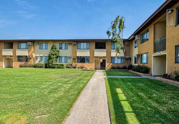 Open grassy area at Serrano Apartments, West Covina