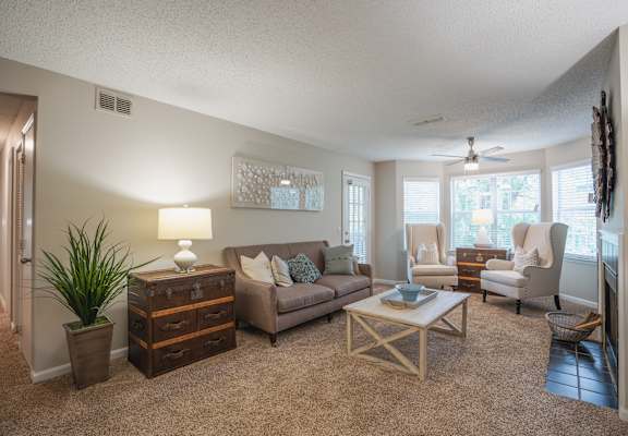 a living room with a couch and a table