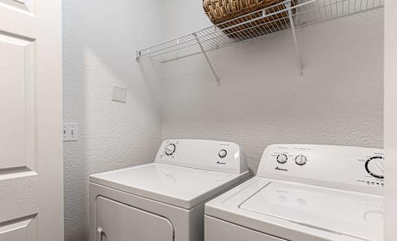 A laundry room with a washer and dryer.