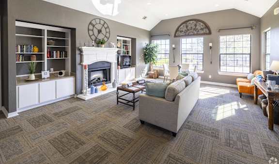 a living room with a couch and a fireplace