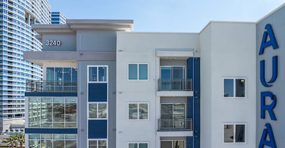 a city building with a blue and white facade and the word agra on it at Aura Vegas Apartments, Nevada, 89103