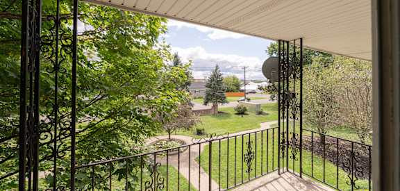 a view of the yard from the balcony of a house