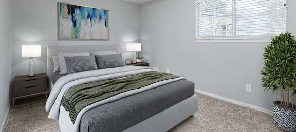 A bedroom with two beds, a ceiling fan, and a painting on the wall.