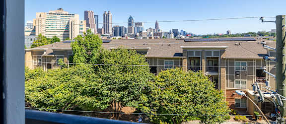the view of the city skyline from a balcony