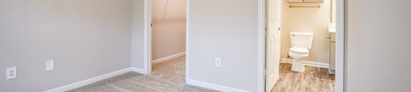 an empty room with a bathroom and a toilet at Carlton Park Apartment Homes, Flowood, MS
