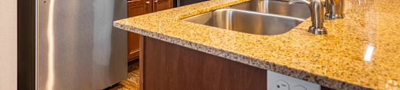 a kitchen with stainless steel appliances and granite counter tops at Kingston Crossing Apartment Homes, Bossier City, LA, 71111