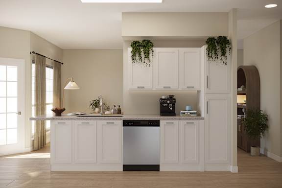 A kitchen with white cabinets and a dishwasher.