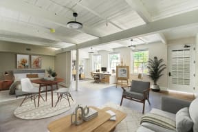 a living room with a couch and a table with chairs at Beverly Village for Living & the Arts Apartments, Massachusetts, 01915