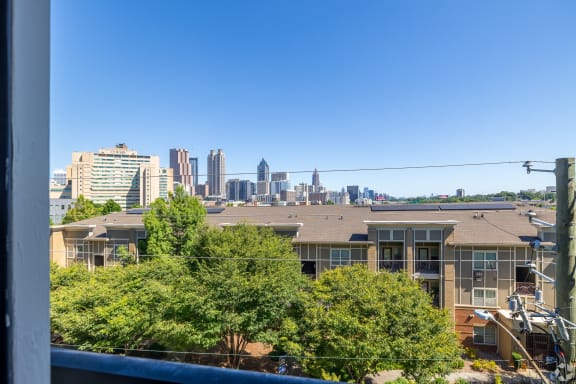the view of the city skyline from a balcony