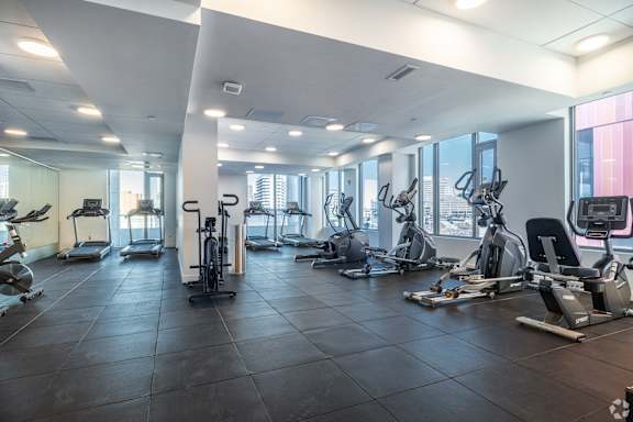 A spacious gym with a variety of exercise equipment.
