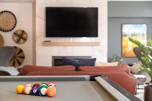 A pool table with a set of billiard balls on it.