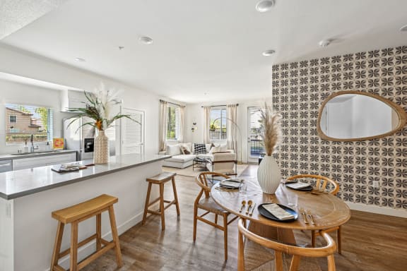 a kitchen with white cabinetry and stainless steel appliances a kitchen with white cabinetry and stainless steel appliances at The Venue at Orange Apartments, California
