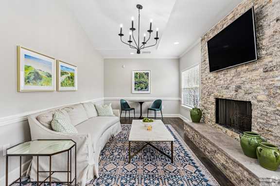 A living room with a fireplace and a couch.