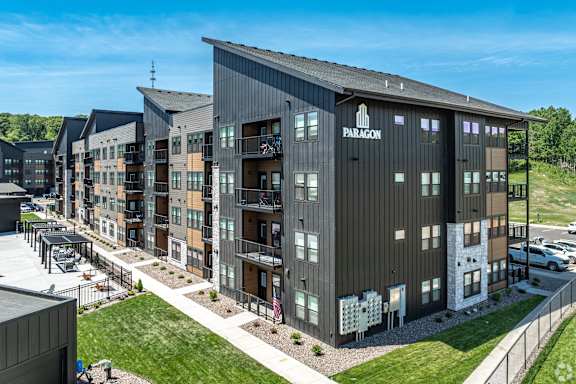 A modern apartment complex named Paragon is shown in the image.