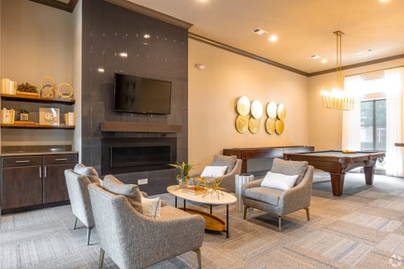 a living room with a couch and a ceiling fan  at Kingston Crossing Apartment Homes, Bossier City, Louisiana, 71111