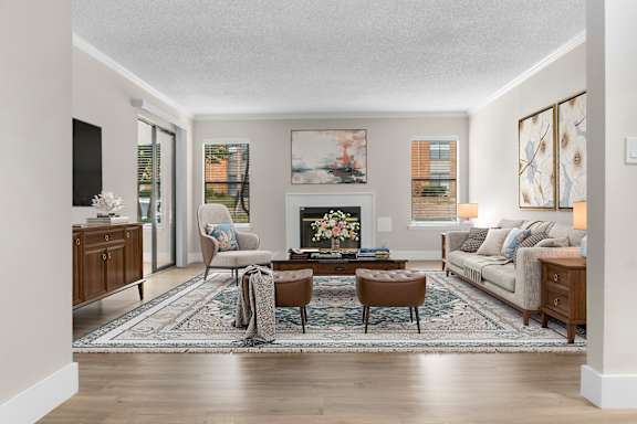 A living room with a fireplace and a couch.