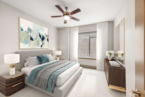 A bedroom with a bed, nightstand, and a painting on the wall.