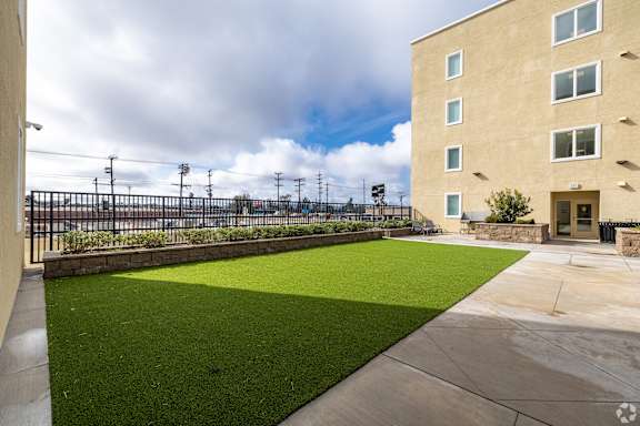 A building with a green lawn in front of it.