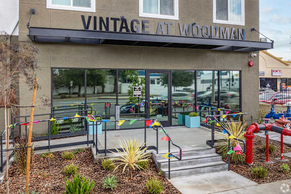 A storefront with the name Vintage at Woodman on the top.