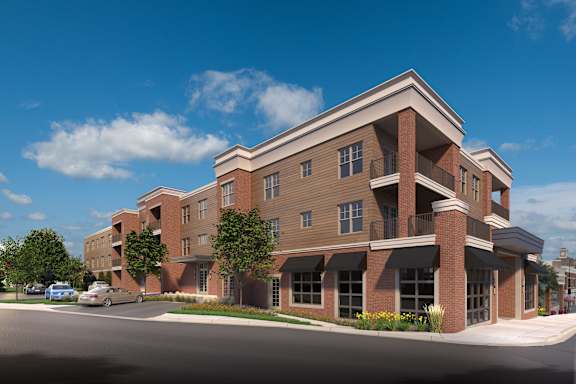 a rendering of a new apartment building on a city street