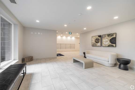 a living room with a white couch and a table