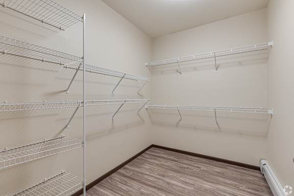 a front loading washer and dryer in a laundry room