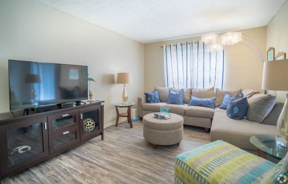 a living room with a couch and a tv