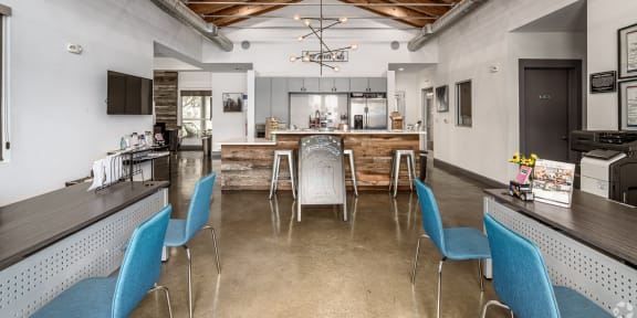 a living room with a kitchen and a dining table