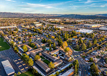 A cityscape with buildings and roads under a clear sky at Cherrywood Apartments, California, 95118