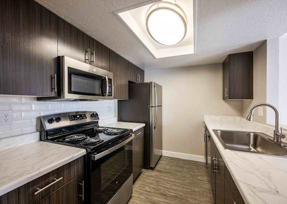modern kitchen with stainless steel appliances in a home