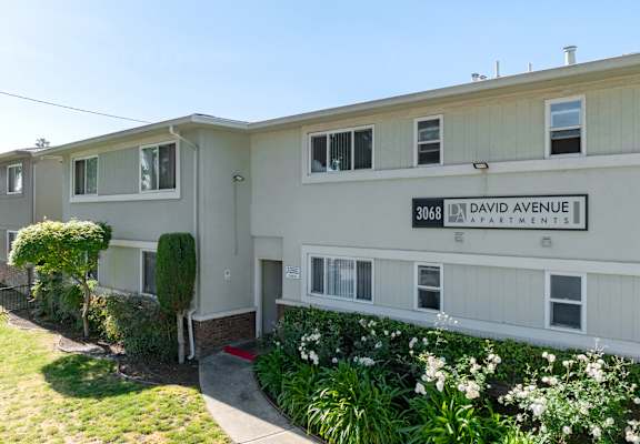 Apartment building with the number 3068 on the front.