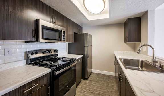 modern kitchen with stainless steel appliances in a home